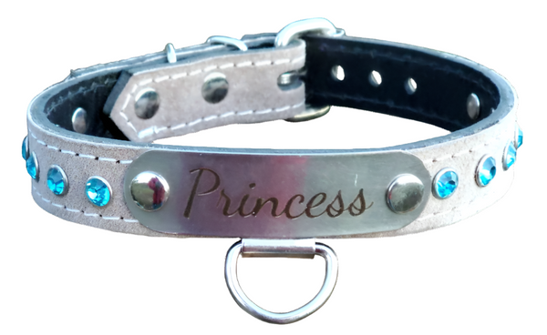 Elevate your BDSM collection with the stunning Suede Bondage Collar, featuring a luxurious nameplate and sparkling crystals for a touch of elegance. Crafted from high-quality suede sewn on top of 9oz full grain leather, this collar combines comfort and durability, designed to withstand both playful and intense sessions.&nbsp;